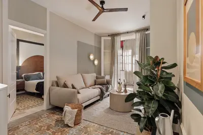 a bedroom with a large bed with a large mirror at Aksaray - 2 bedrooms in Eixample Esquerra in Barcelona