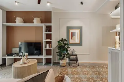 a kitchen with a wooden table and chairs at Aksaray - 2 bedrooms in Eixample Esquerra in Barcelona