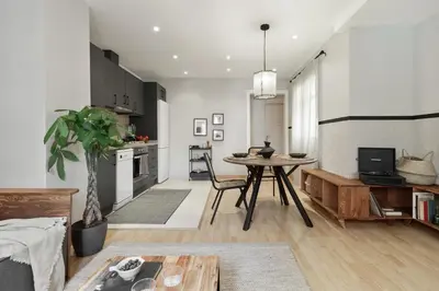 a dining room with a table and chairs and a television at Ceret - 1 bedroom in Gòtic in Barcelona