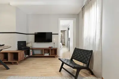 a living room with a couch and a table at Ceret - 1 bedroom in Gòtic in Barcelona
