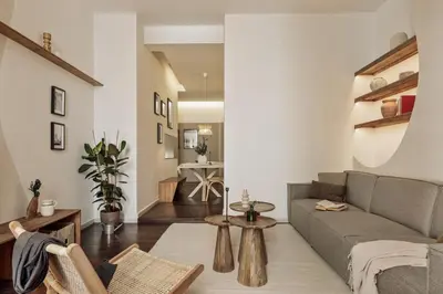 a living room with a couch and shelves with vases at Ilani - 2 bedrooms in El Gòtic in Barcelona