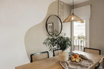 a desk in a room with three pictures on the wall at Dota - 3 bedrooms in Sant Gervasi - Galvany in Barcelona