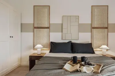 a living room with a gray couch and a table at Huila - 2 bedrooms and balcony in Les Corts in Barcelona