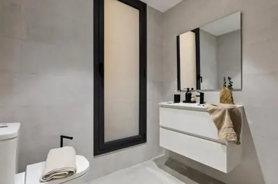 a bedroom with a bed and a table with a lamp at Belua - 2 bedrooms in Sarrià in Barcelona