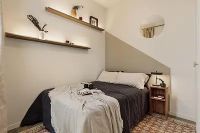a mirror and a bag hanging on a wall at Pavona - 2 bedrooms and terrace in Sants in Barcelona