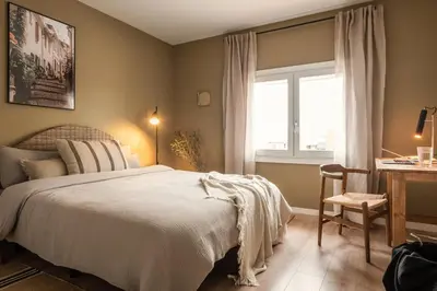 a tray of bread and a cup on a bed at Remy - 2 bedrooms and terrace in Eixample Dreta in Barcelona