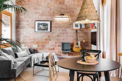 a dining room with a black table and chairs at Rio Doce - 1 bedroom and terrace in Gòtic in Barcelona