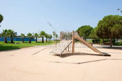 a playground in a park with a slide at Beach vibes in Castelldefels in Castelldefels