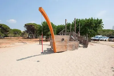a playground in a park with an orange slide at Beach vibes in Castelldefels in Castelldefels