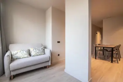 a living room with a couch and a table at Sagrada família essence in Barcelona