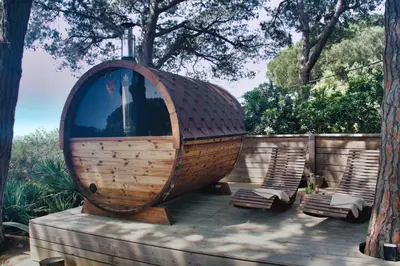 a wooden boat sitting on top of a wooden deck at Pergola Suite - Boutique Retreat Loft Barcelona Coast Panoramic Sea View in Sant Andreu de Llavaneres