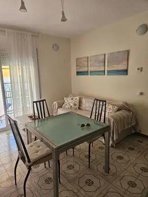 a living room with a table and chairs and a couch at Apartamento Luminoso en el Centro de Sitges in Sitges