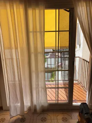 an open door with a view of a balcony at Apartamento Luminoso en el Centro de Sitges in Sitges