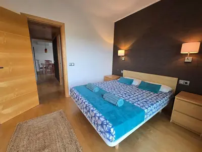 a living room with a white couch and a table at Aquamarina Apt | Seaviews | 1' beach | Family in San Pol de Mar
