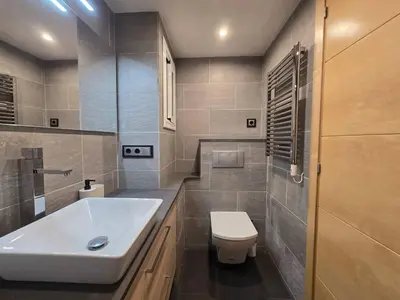 a bathroom with a white sink and a toilet at Aquamarina Apt | Seaviews | 1' beach | Family in San Pol de Mar