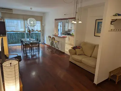 a living room with a couch and a table at Large and calm 3 bedroom apartment with terrace in Barcelona