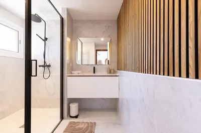 a bathroom with a shower and a sink at Villa Carmen - Peaceful Eco-Luxury with private pool in Cunit