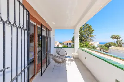 a balcony with a view of a swimming pool at Villa Carmen - Peaceful Eco-Luxury with private pool in Cunit