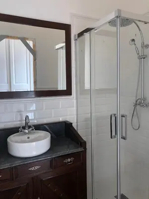 a bathroom with a sink and a shower at Casa l'àvia - Sant Pol de Mar in San Pol de Mar
