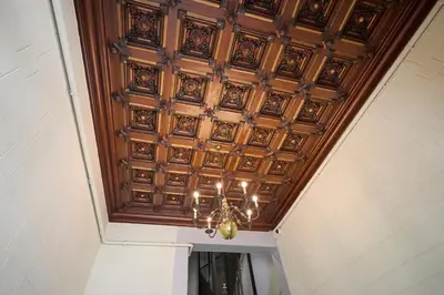 a coffered ceiling with a chandelier in a hallway at 12DIA1008 - Fantastic Apartment in Diagonal in Barcelona