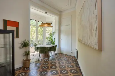 a dining room with a table and chairs and a window at 12DIA1008 - Fantastic Apartment in Diagonal in Barcelona