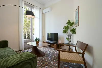 a living room with a couch and a table at 12DIA1008 - Fantastic Apartment in Diagonal in Barcelona