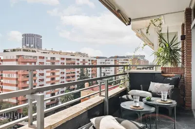 a bedroom with a bed and a side table at Montseny - 2 bedroomd and terrace in Montseny in Barcelona