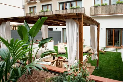 a kitchen and dining room with a table and chairs at Pasir - 2 bedrooms and terrace in Gràcia in Barcelona