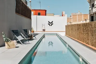 a swimming pool on the roof of a building at Pasir - 2 bedrooms and terrace in Gràcia in Barcelona