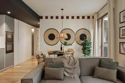 a bedroom with a bed with a large mirror above it at Mawun - 2 bedrooms in Gràcia in Barcelona