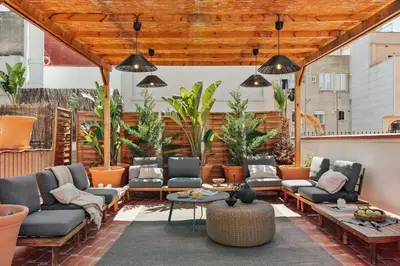 a bedroom with a bed and a bathroom at Sanur - 2 bedrooms in Gràcia in Barcelona