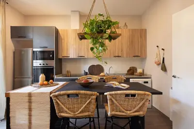 a living room with a table and a tv at Damar - 2 bedrooms and balcony in Eixample Dreta in Barcelona