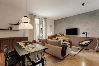 a bedroom with a large bed with a wooden headboard at Yari - 3 bedrooms and terrace in Sant Gervasi in Barcelona