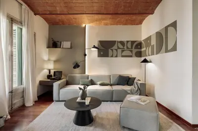 a dining room with a wooden table and chairs at Cotoca - 3 bedrooms and balcony in Eixample Dreta in Barcelona