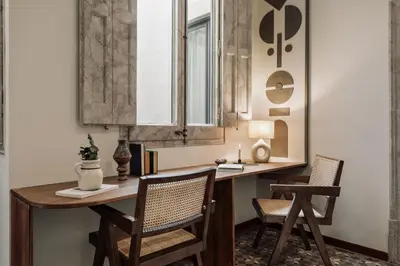 a bedroom with a bed and a chair and a window at Cotoca - 3 bedrooms and balcony in Eixample Dreta in Barcelona