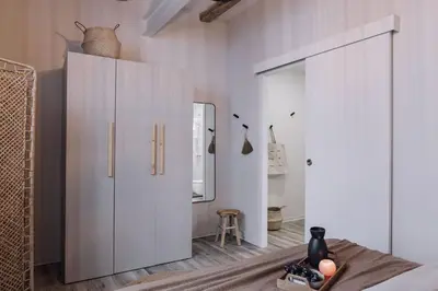 a hallway with a bunch of pictures on the walls at Velez - 1 bedroom in Gràcia in Barcelona