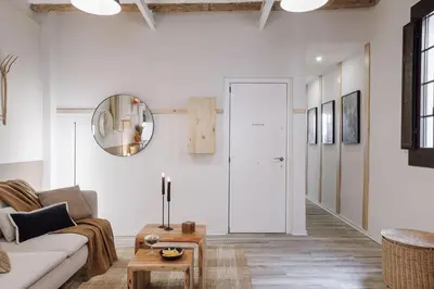 a white bathroom with a sink and a mirror at Velez - 1 bedroom in Gràcia in Barcelona