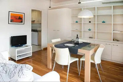 a kitchen and dining room with a table and chairs at Attic with terrace Barcelona center in Barcelona