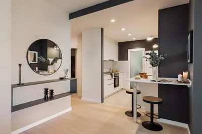 a bedroom with a desk and a chair next to a bed at Katz - 3 bedrooms and terrace in Les Corts in Barcelona