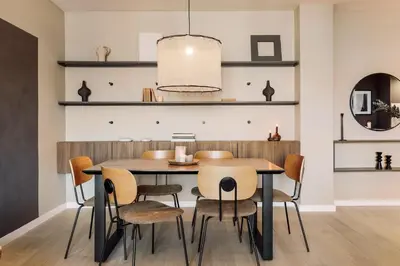 a kitchen and living room with a counter and a mirror at Katz - 3 bedrooms and terrace in Les Corts in Barcelona