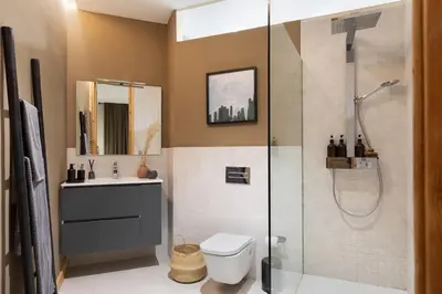 a bedroom with a large white bed and a desk at Amazzer - 3 bedrooms in Eixample Esquerra in Barcelona