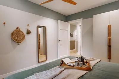 a bedroom with a large bed with a wooden headboard at Laurel - 3 bedrooms in Sant Gervasi in Barcelona