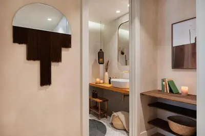 a living room with a couch and a kitchen at Merzouga - 1 bedroom, a pool and terrace in Gràcia in Barcelona