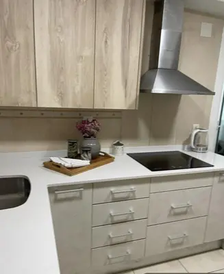 a kitchen with a sink and a counter top at Alojamiento espacioso ideal para visitas en grupo in Terrassa