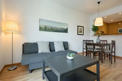 a living room with a couch and a table at 1IND1011 - One bedroom apartment in Barcelona