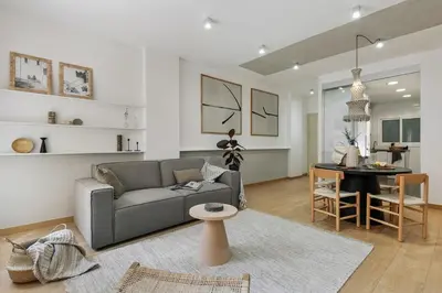 a hallway with a door leading to a living room at Agnello - 3 bedrooms and office in Sant Gervasi in Barcelona