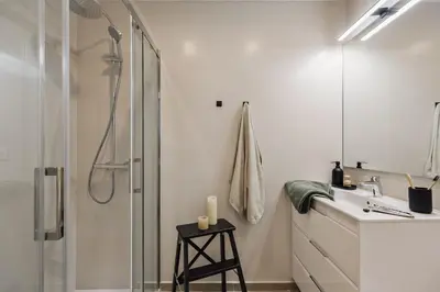 a bedroom with a bed with a book on it at Briso - 3 bedrooms and balcony in Vila de Gràcia in Barcelona