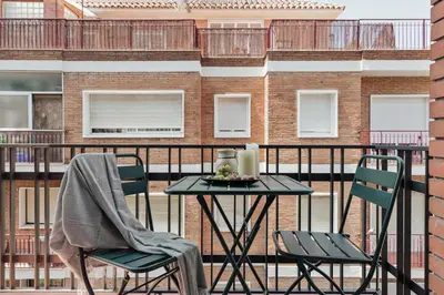a living room with a couch and a table at Briso - 3 bedrooms and balcony in Vila de Gràcia in Barcelona