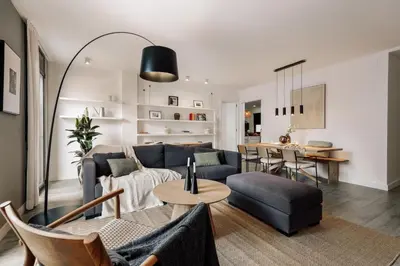 a living room with a couch and a television in a room at Elan - 2 bedrooms and balcony in Sant Gervasi in Barcelona