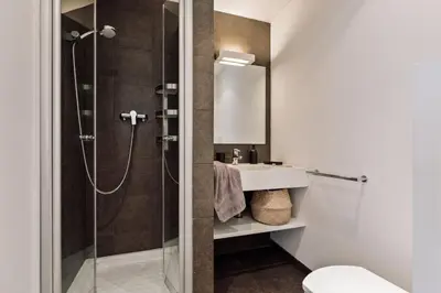 a bedroom with a large bed with two tables at Elan - 2 bedrooms and balcony in Sant Gervasi in Barcelona